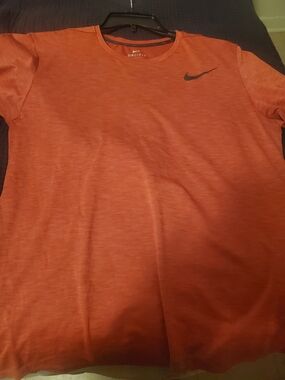 Nike Men’s Orange Dri-FIT Short Sleeve Shirt with Black Swoosh